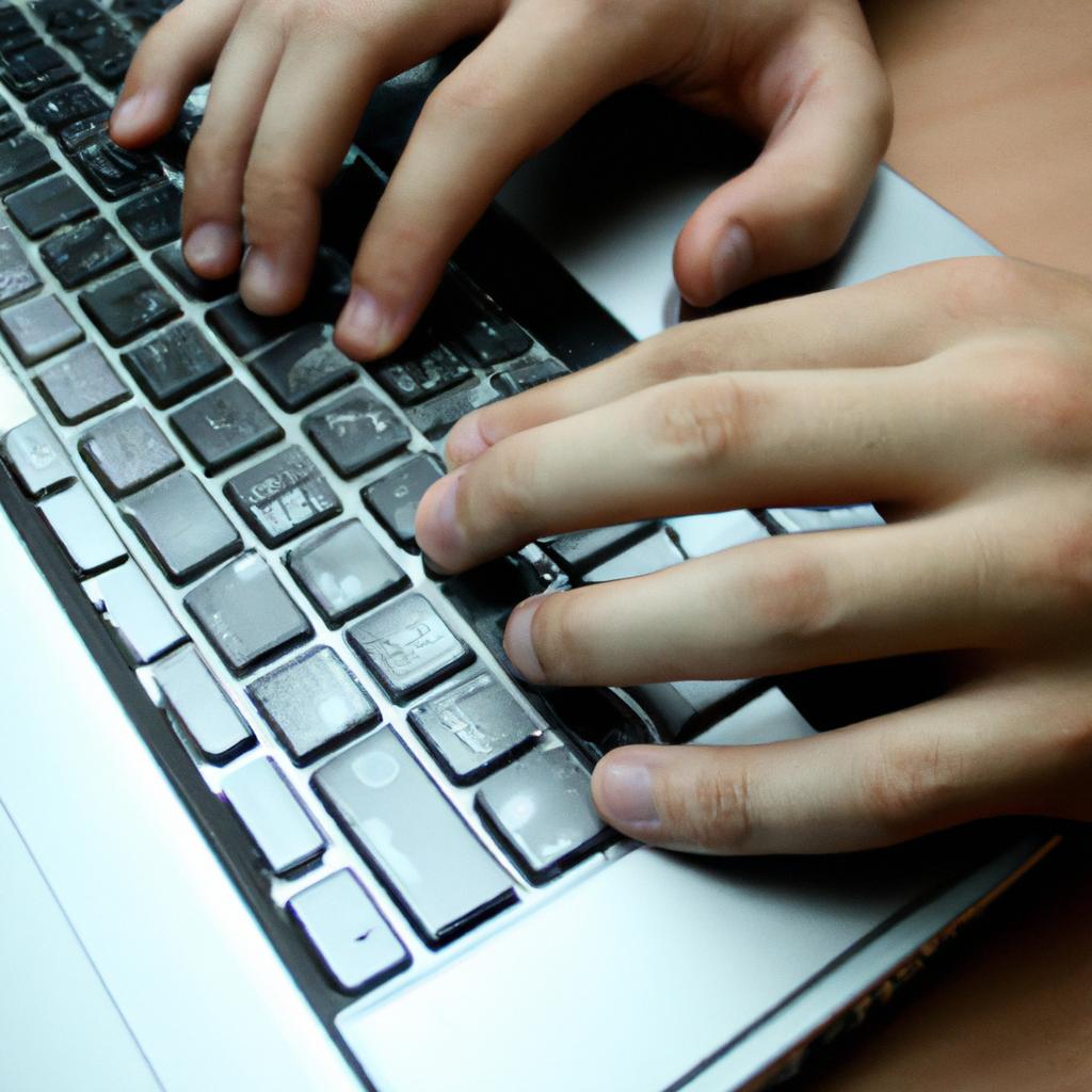 Person using a computer, typing